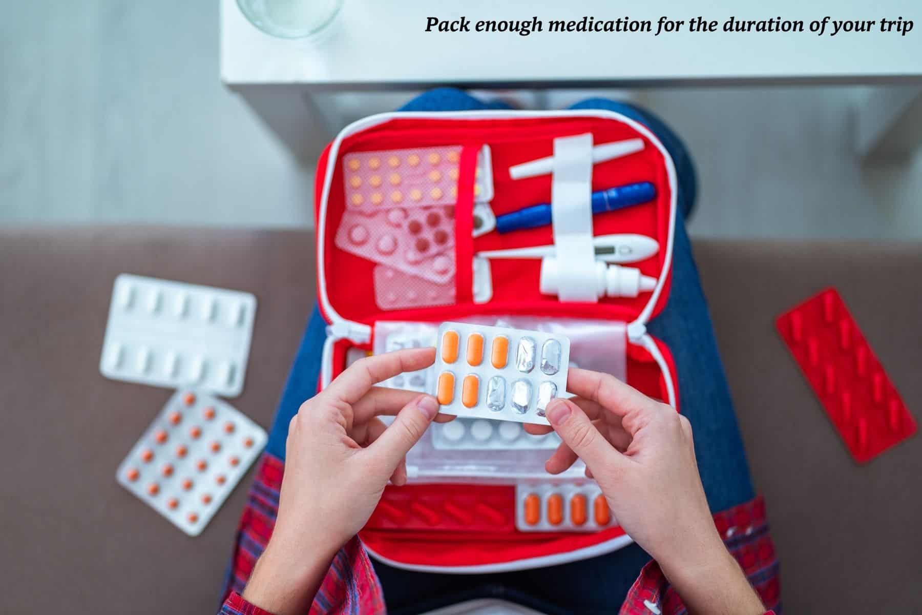 Woman packing medical supplies in a first aid kit - travel with a medical condition 