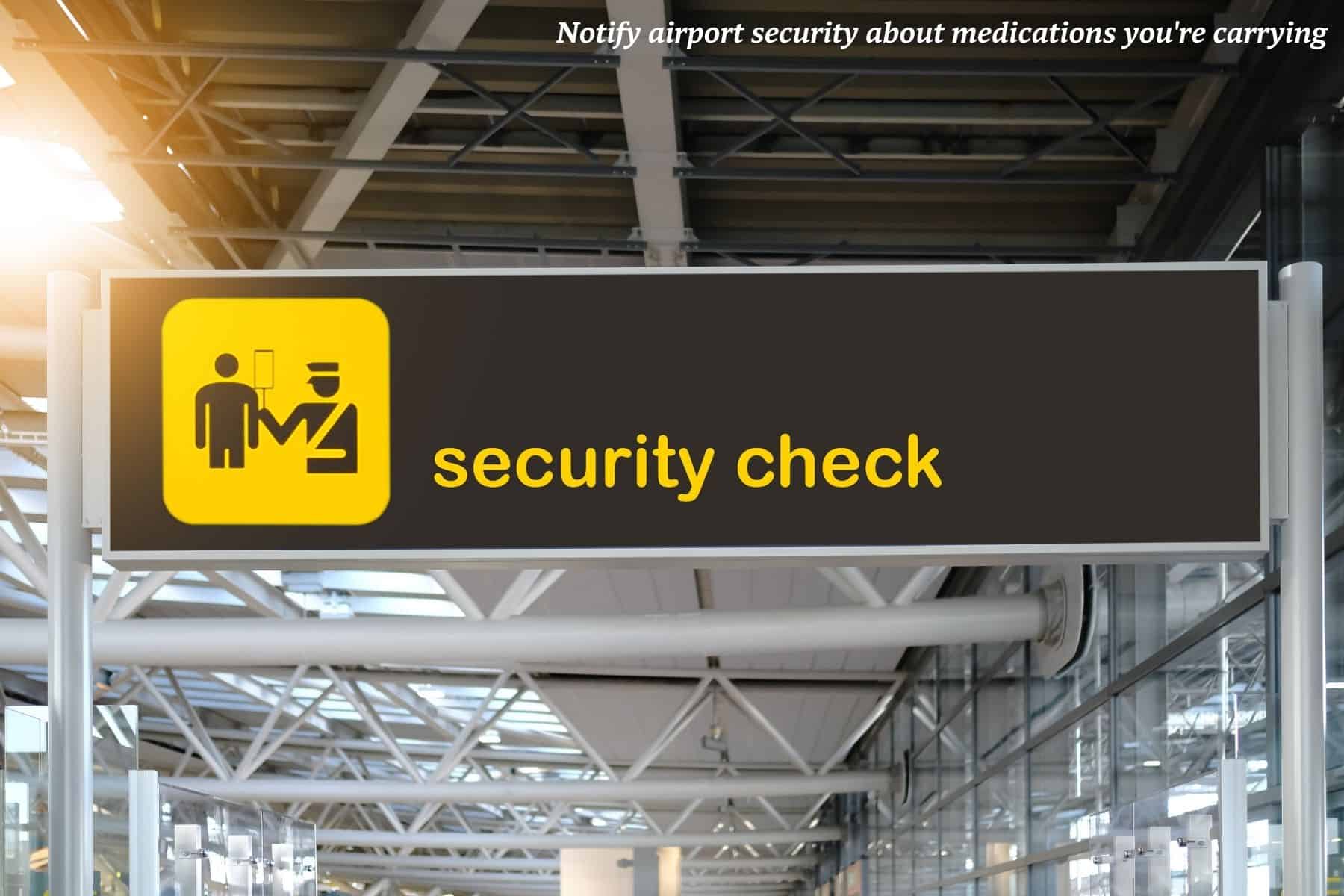 Security check sign at an airport in England - travel with a medical condition 